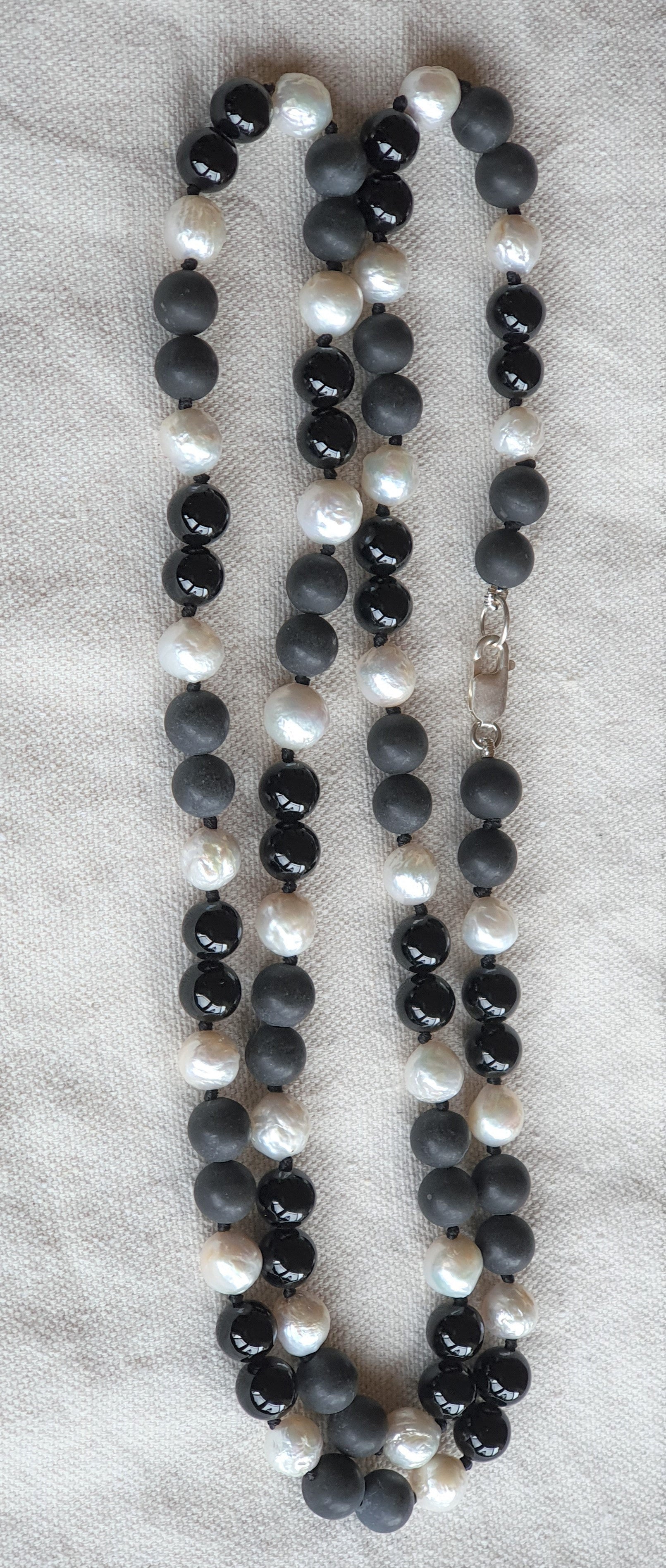 Silver necklace hotsell with black stone